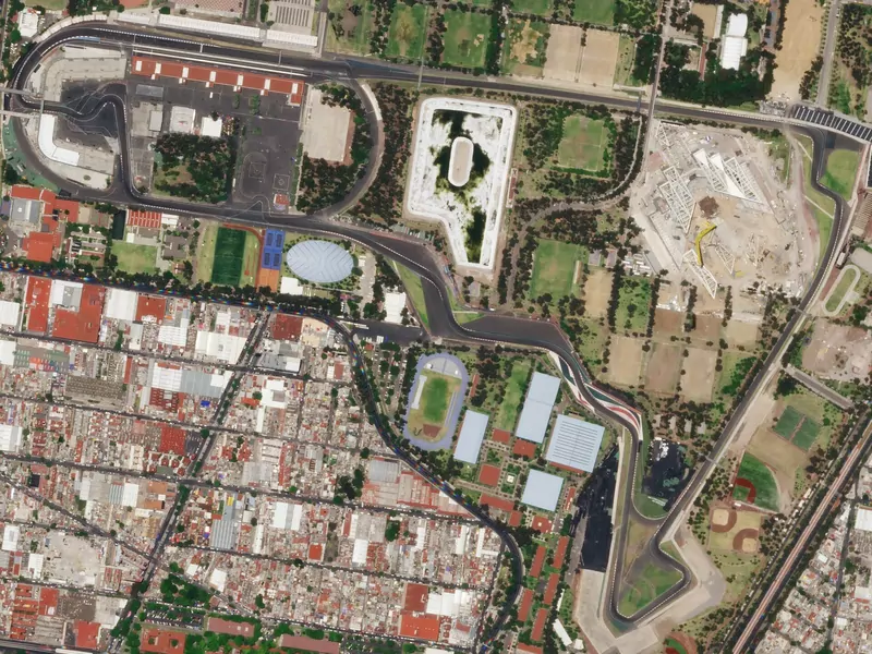 Satellite view of the Autódromo Hermanos Rodríguez circuit in Mexico City, with the track looping around sports fields and the stadium section