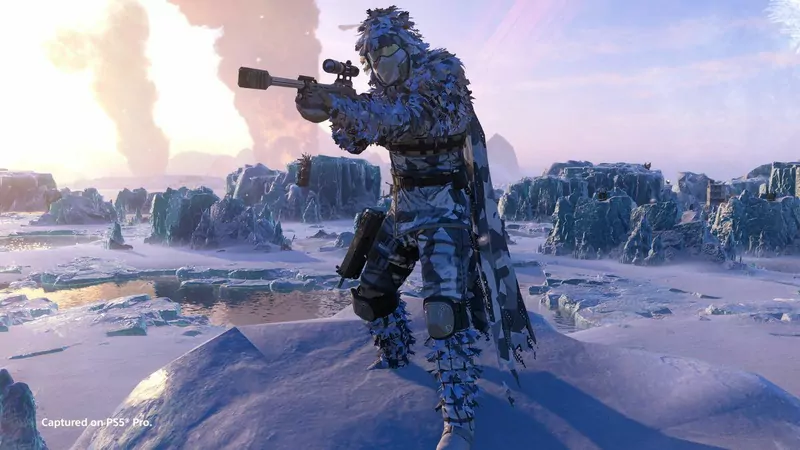 A Helldiver in camouflage armor aiming a weapon across a snowy, rocky landscape