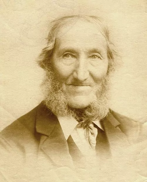 Sepia portrait of Samuel Parnell, an elderly man with a white beard, wearing a dark jacket and a tie