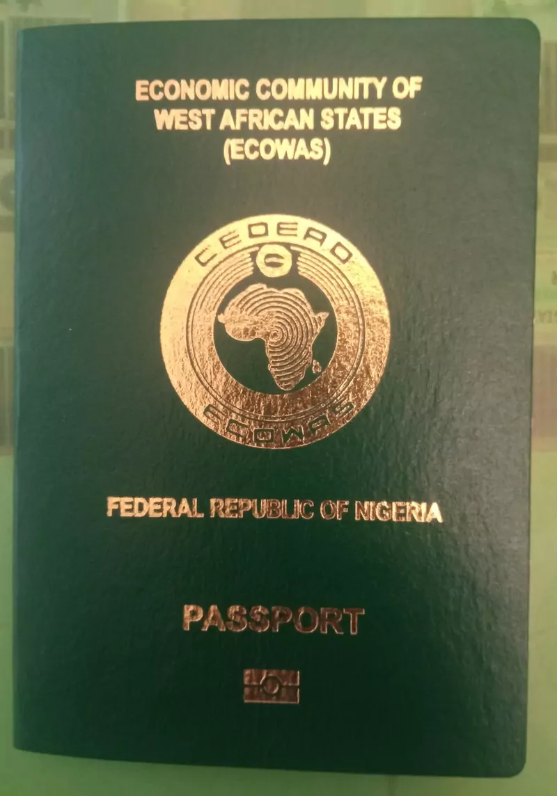 The dark green cover of a Nigerian biometric passport with a gold ECOWAS emblem and the words Economic Community of West African States, Federal Republic of Nigeria and Passport