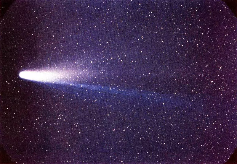 Halley's Comet with its long bright tail stretching across a dense field of stars