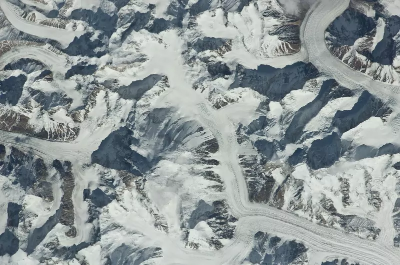 Snow-covered mountains and glaciers of the Karakoram range seen from space