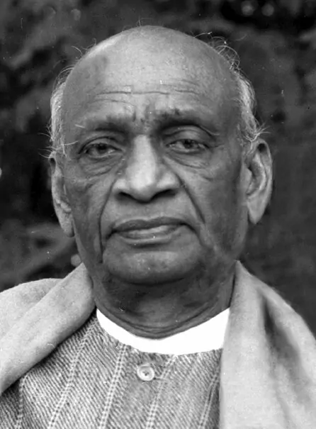 A black and white portrait of Sardar Vallabhbhai Patel wearing a shawl