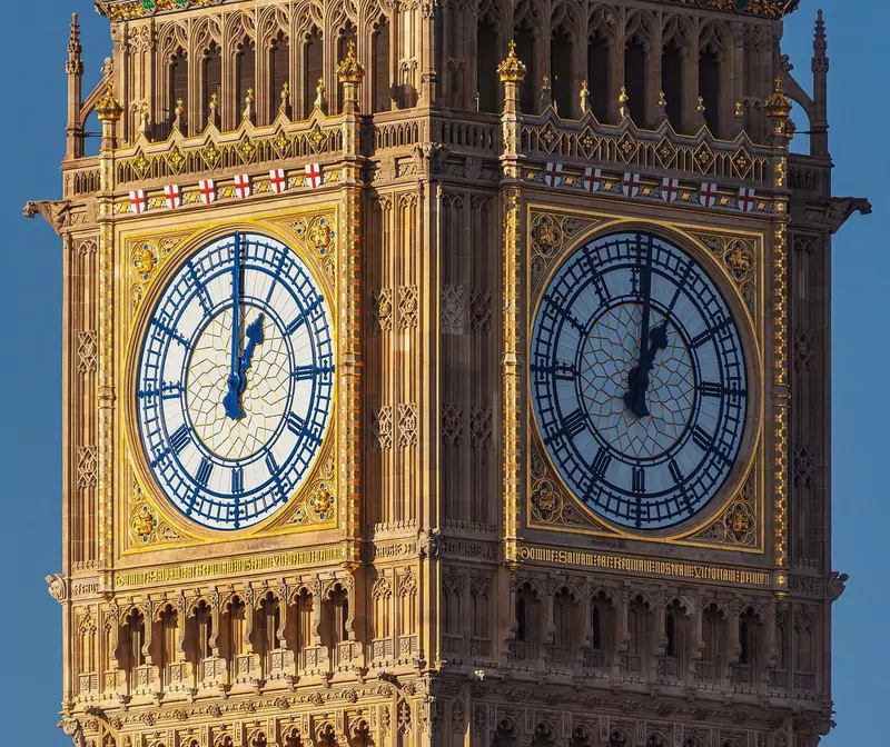 Close view of two of the restored blue and gold clock faces on the Elizabeth Tower in London